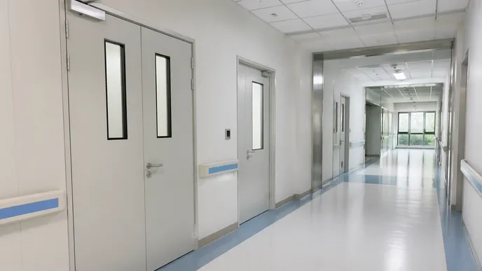 Aluminum commercial doors in hospital corridor and education facility access points
