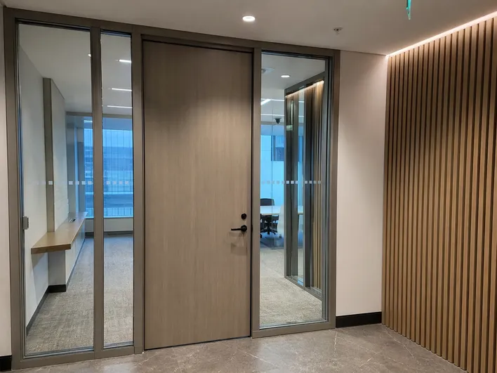 Architectural commercial doors in corporate office fit-out matching architect door schedule specification