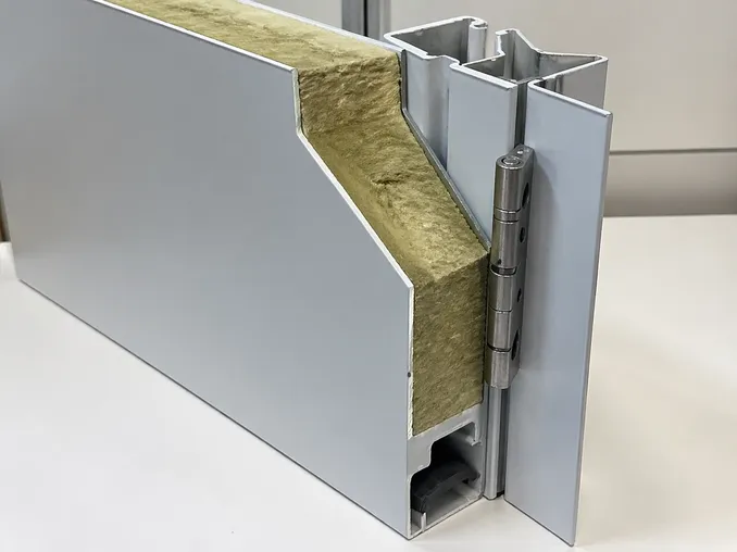 Cross-section detail of EUWOO commercial steel door showing SPCC body, mineral wool infill, and roll-formed frame