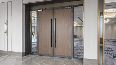Double commercial doors at hotel ballroom entrance with premium hardware