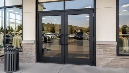 Double commercial doors at retail chain storefront entrance