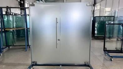 Frosted acid-etched glass door showing post-temper etching surface quality