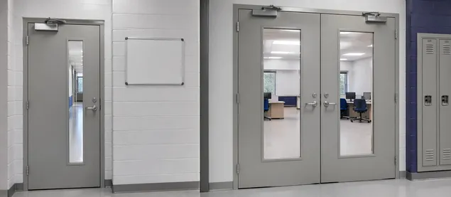 Vision panel commercial doors in institutional building — schools, government offices, and transit facilities