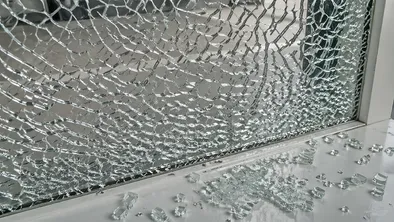 Tempered glass breakage pattern showing small blunt fragments