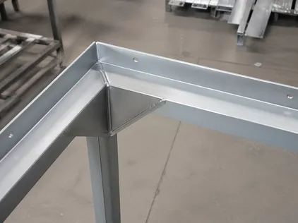 Welded corner gusset construction on hollow metal door frames — 1.5mm minimum gauge
