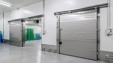 Thermal industrial doors for cold storage and food processing facilities