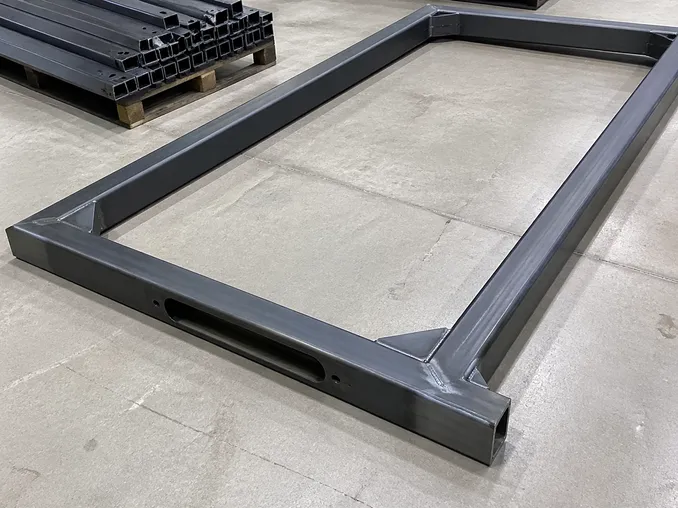 Industrial commercial door frame construction — welded corner gussets and reinforced mortise lock pocket detail
