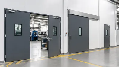 Industrial commercial doors installed in a manufacturing plant production floor