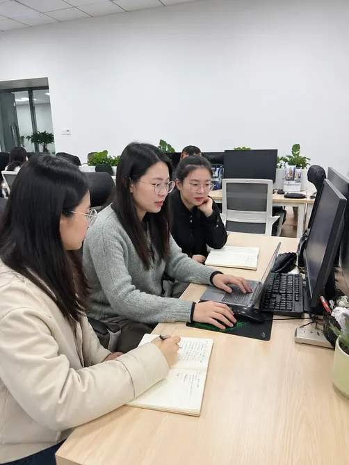 EUWOO sales team reviewing customer inquiries