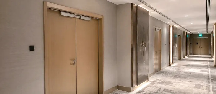 Automatic fire doors in hotel corridor for hospitality fire safety compliance
