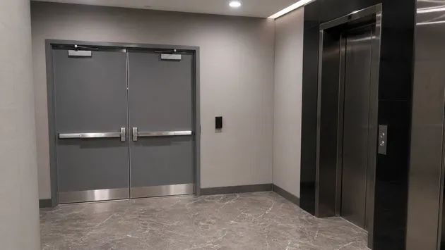 Double leaf fire doors at commercial high-rise elevator lobby — CE certified assemblies for building control sign-off