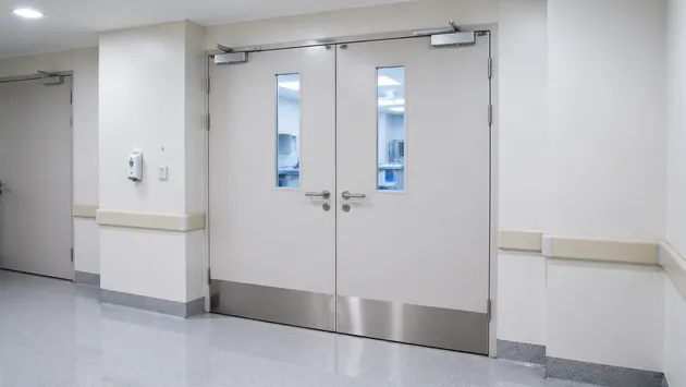 Double leaf fire doors in hospital corridor — FD60 and FD90 rated assemblies for healthcare fire compartment boundaries