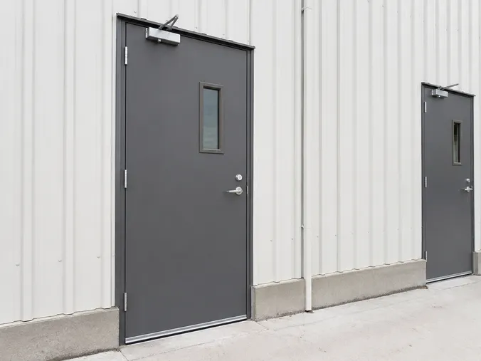 EUWOO exterior fire door — weather-sealed steel construction with drop-seal threshold