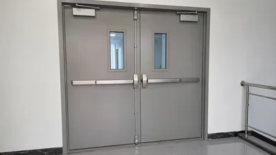 Double leaf fire door for wide openings and high-traffic corridors