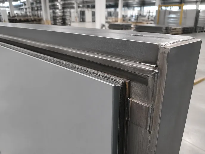 Industrial fire door intumescent seal recessed into machined channel with 2.0mm welded steel frame