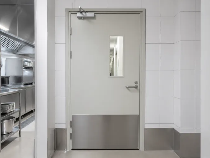 EUWOO kitchen fire door — stainless hardware, grease-resistant powder coat finish, commercial kitchen installation