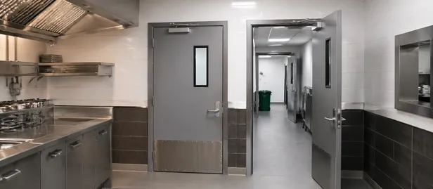 Commercial kitchen fire door installation in restaurant chain fit-out project