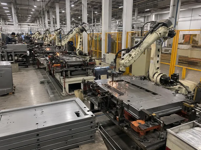 Robotic MIG welding line for commercial security door body panels at EUWOO factory