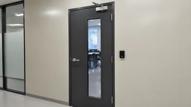 Commercial security door configured for office buildings and retail with vision panel