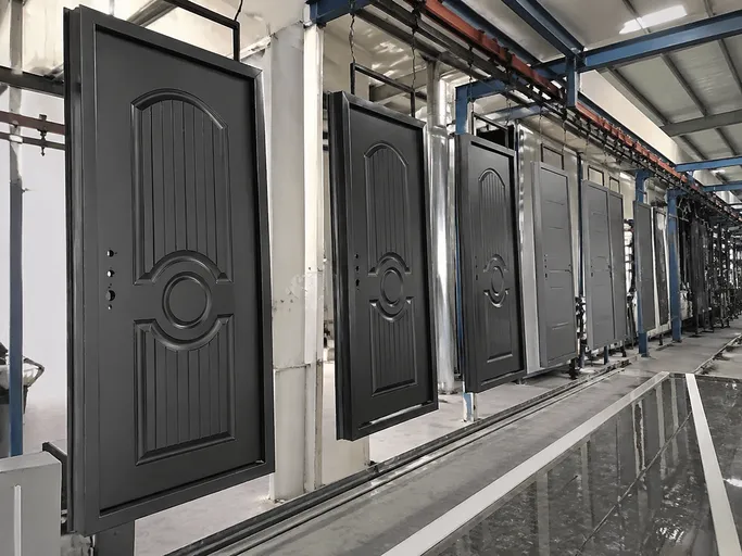 Automated powder coating line applying 60–80μm film to iron security door panels