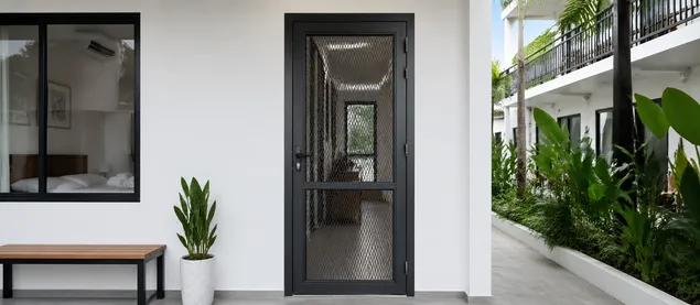 Mesh security door at guesthouse or small hotel service entry