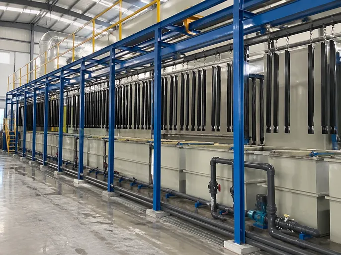 Electrostatic powder coating line for security door frames with zinc phosphate pre-treatment