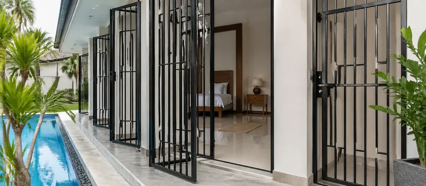 Custom security grill doors for hospitality and resort properties in tropical destinations