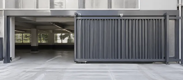 Sliding security door for parking structure vehicle access with corrosion-resistant coating