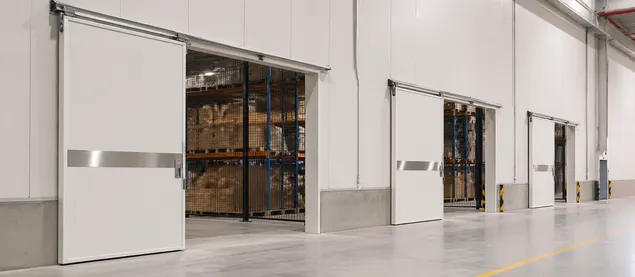 Sliding security doors installed in warehouse logistics facility with internal security partitions