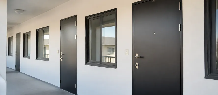 Steel security door replacement for property management portfolio renovation
