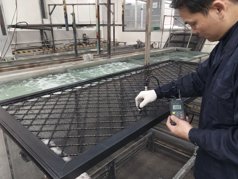 Wire mesh security door powder coating process showing zinc phosphate pre-treatment bath and film thickness measurement at weld nodes
