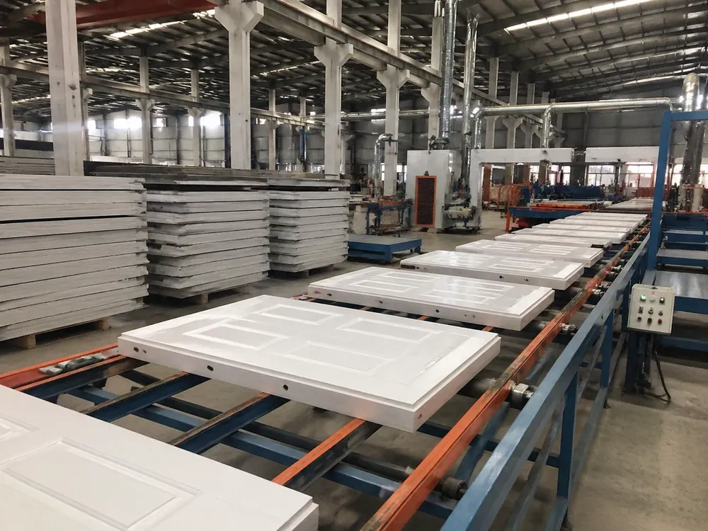 EUWOO factory floor showing 6 panel steel door production line