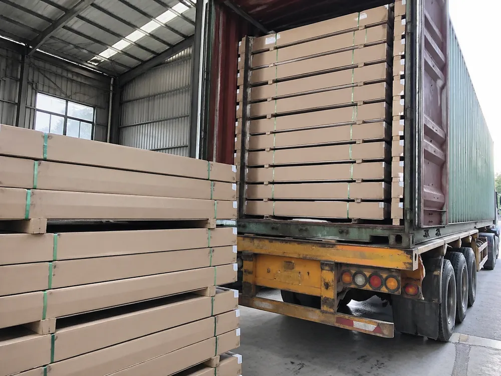Steel door flat-pack KD containers being loaded for export at EUWOO factory