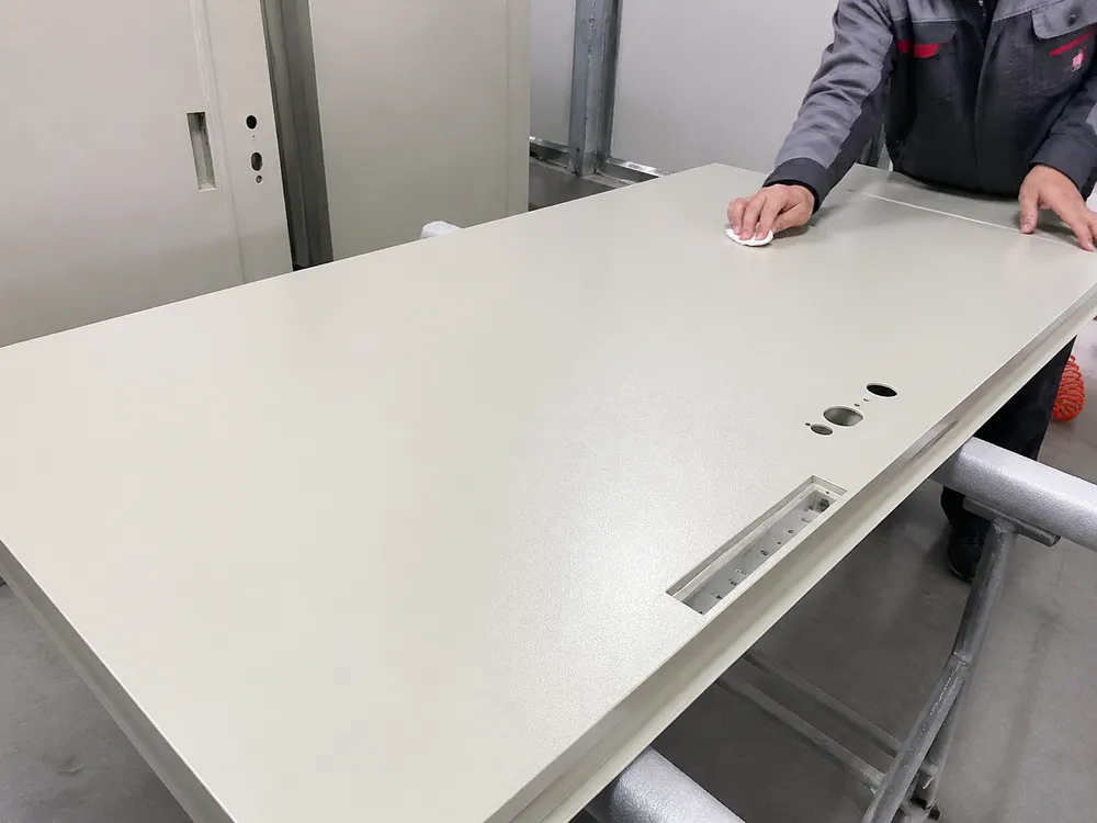 Office steel door flush face panel — powder coat surface inspection detail